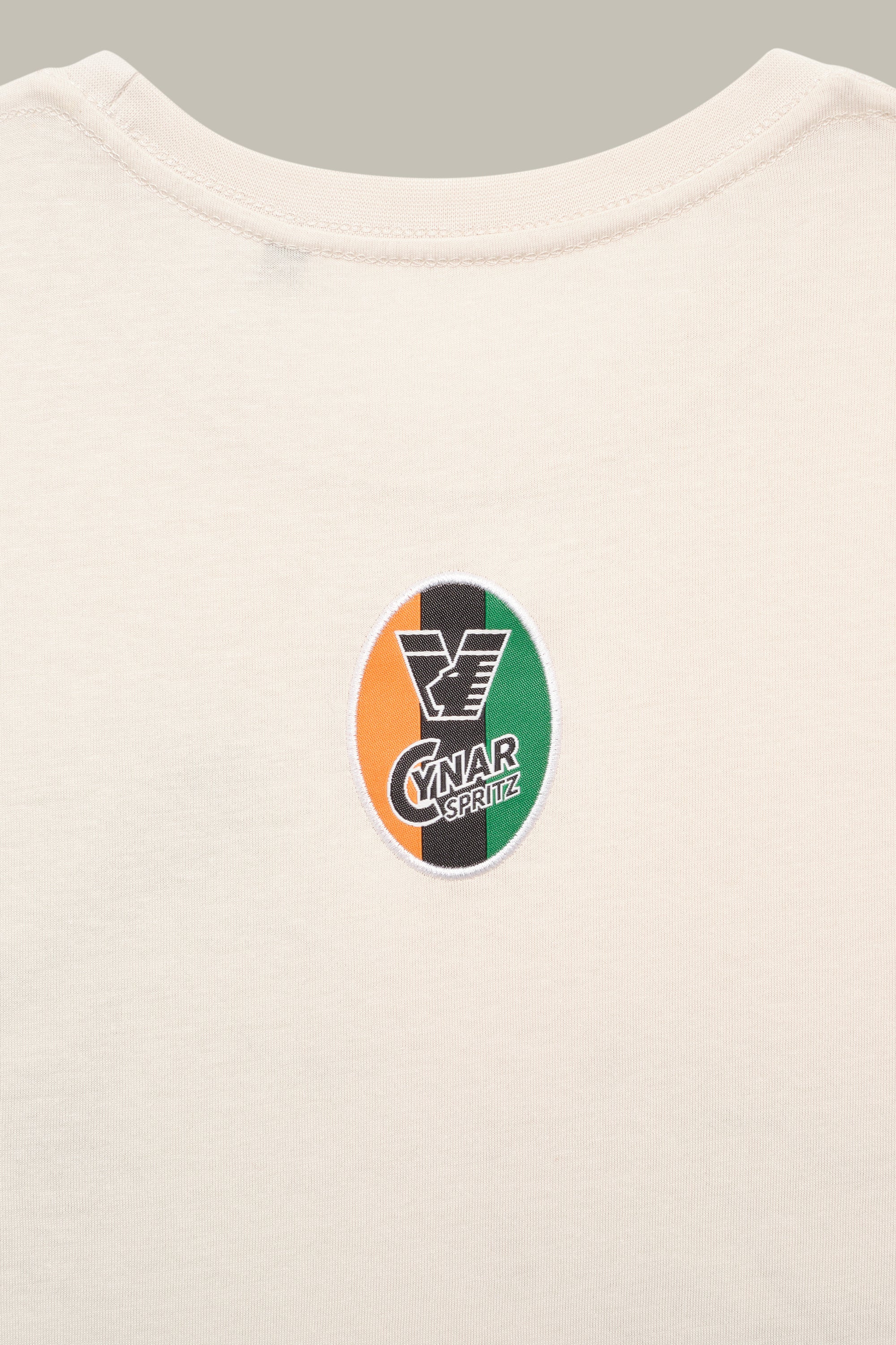 25/26 Cynar Spritz Graphic Sand Tee - Image 4