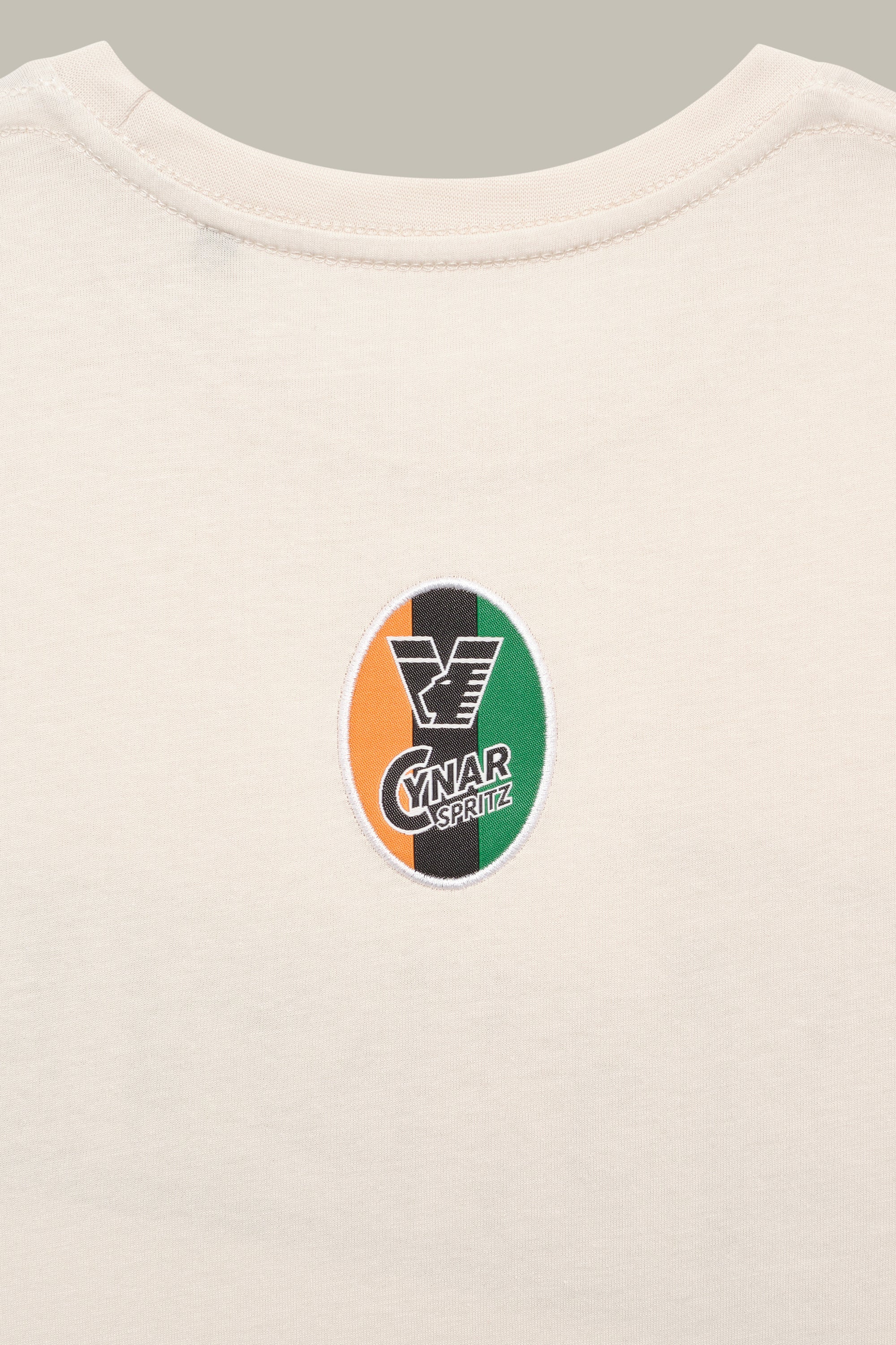 25/26 Cynar Spritz Postcard Sand Tee - Image 4